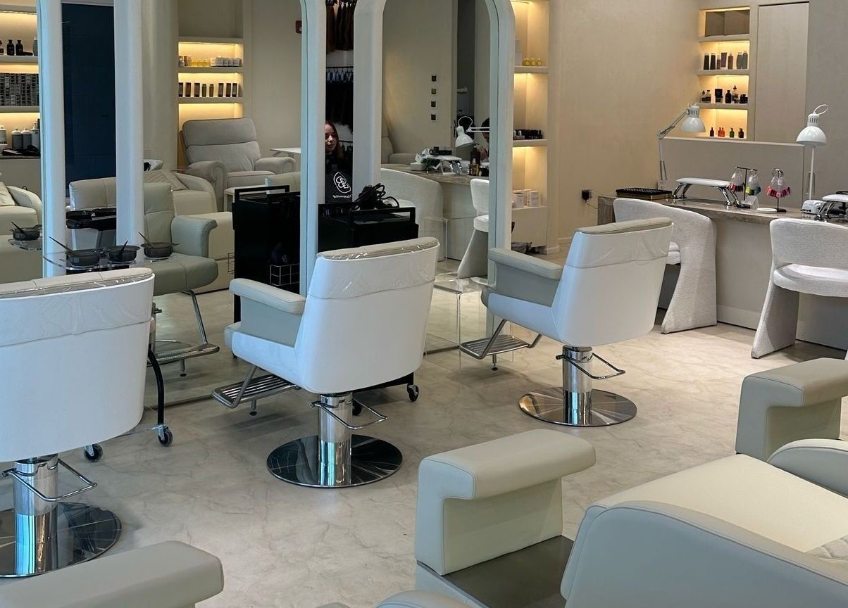 Sleek beauty salon space at Billionhairs Lounge Beauty Salon, Doha, Doha Municipality, QA with modern chairs.