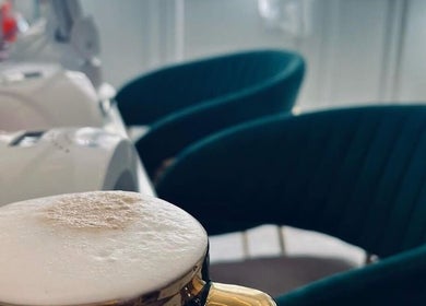 Enjoy a luxury cappuccino in the cozy seating area at Fran’s Nail Boutique, Il-mosta, MT.