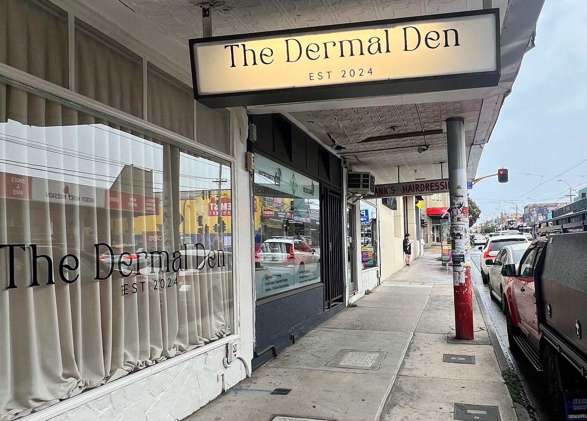 Front view of The Dermal Den on a busy street in Northcote, Victoria, AU.