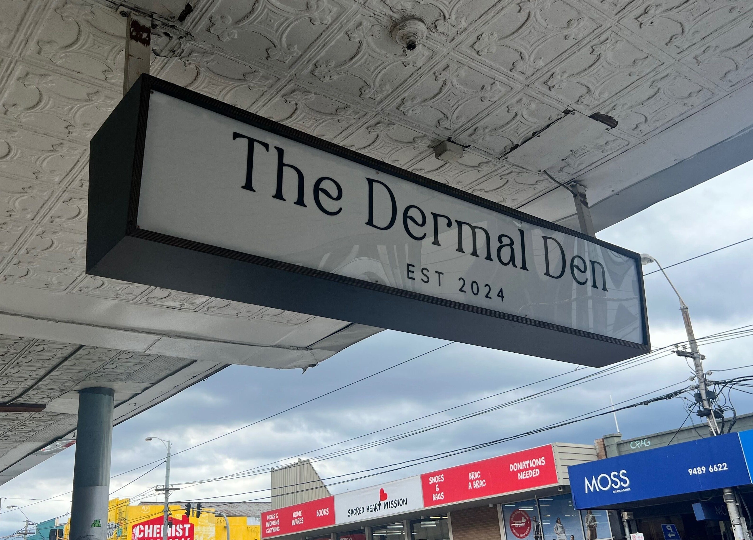 Signage of The Dermal Den in Northcote, Victoria, AU showcasing modern elegance.