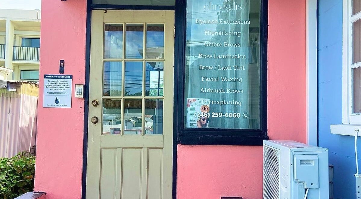 Entrance of Chrysalis Studio & Academy in Bridgetown, Christ Church, BB, showcasing services on the window.