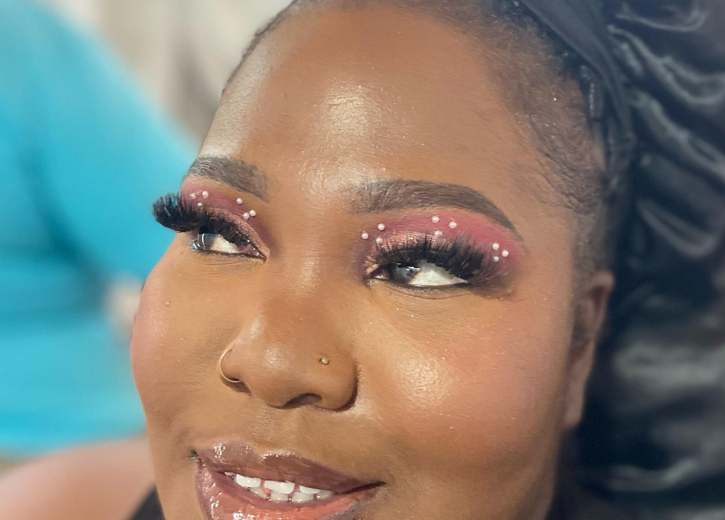 Close-up of elegant eye makeup with gems at Jibeautyplus, Roseau, Saint George Parish, DM.