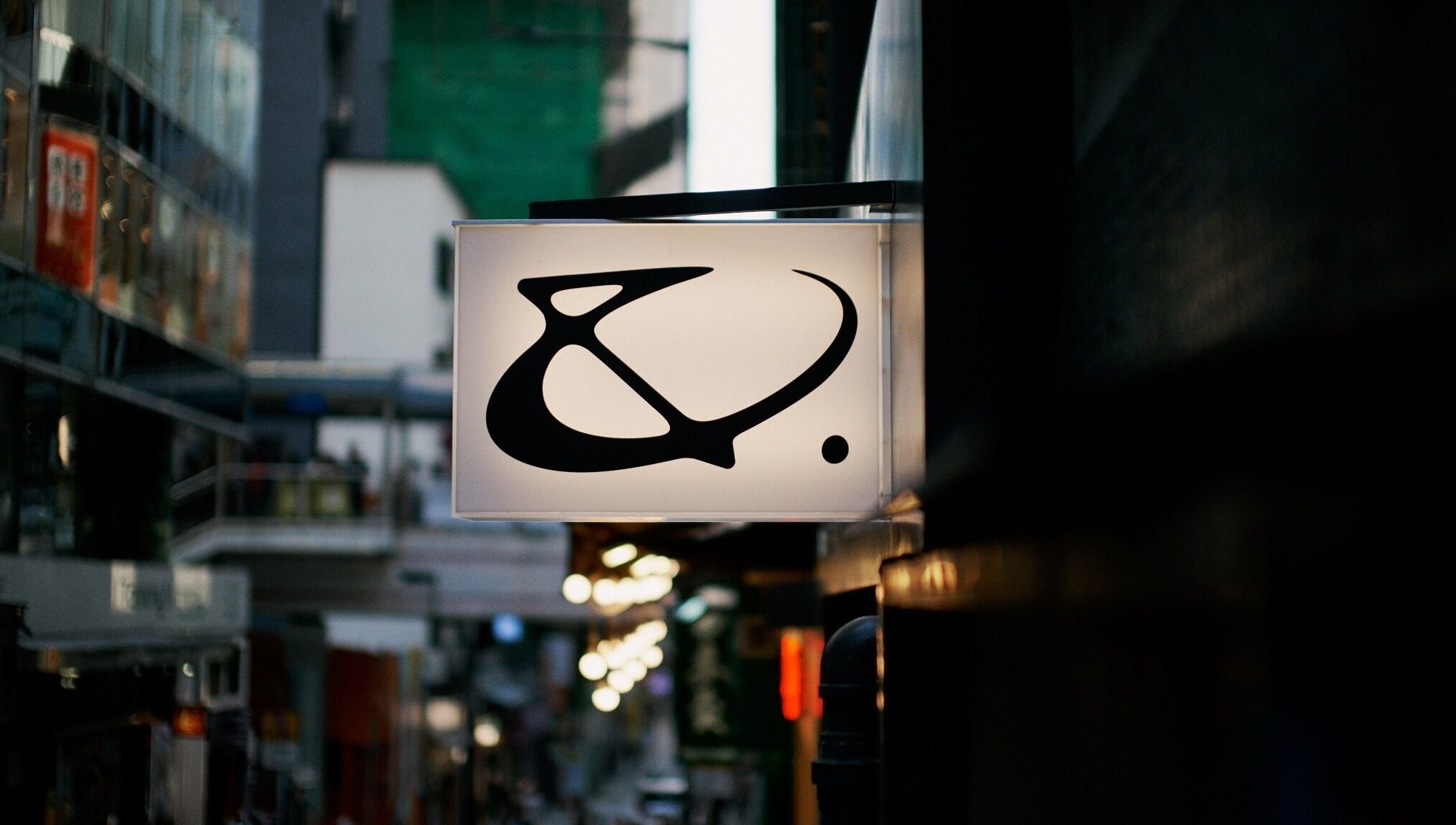 AndSpace sign glowing in urban night on Hong Kong Island, HK, creating an inviting ambiance.