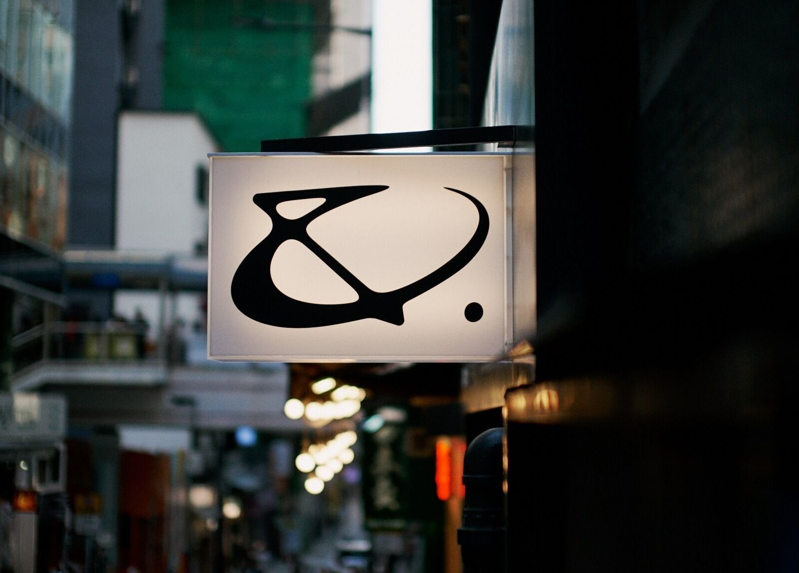 AndSpace sign glowing in urban night on Hong Kong Island, HK, creating an inviting ambiance.