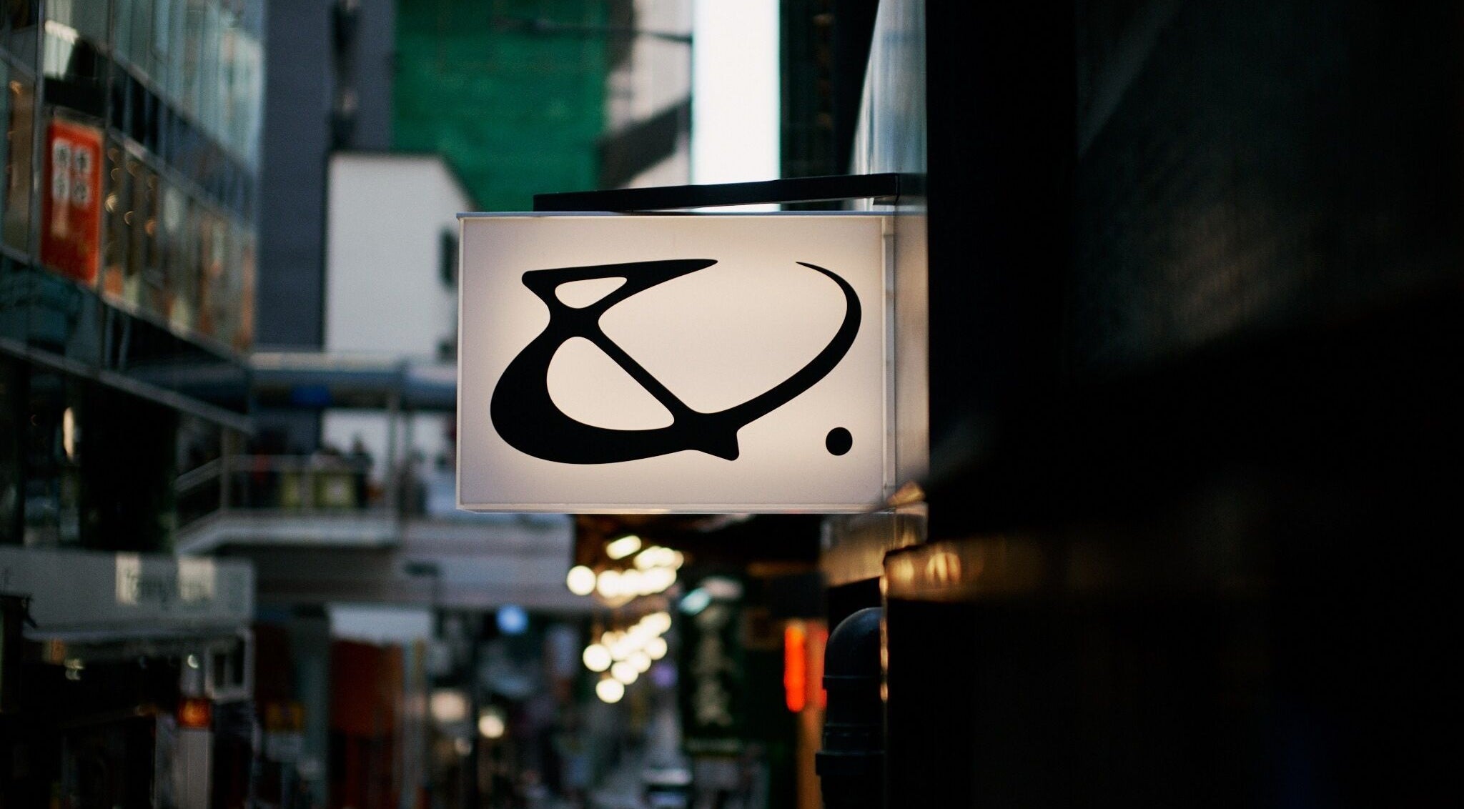 AndSpace sign glowing in urban night on Hong Kong Island, HK, creating an inviting ambiance.