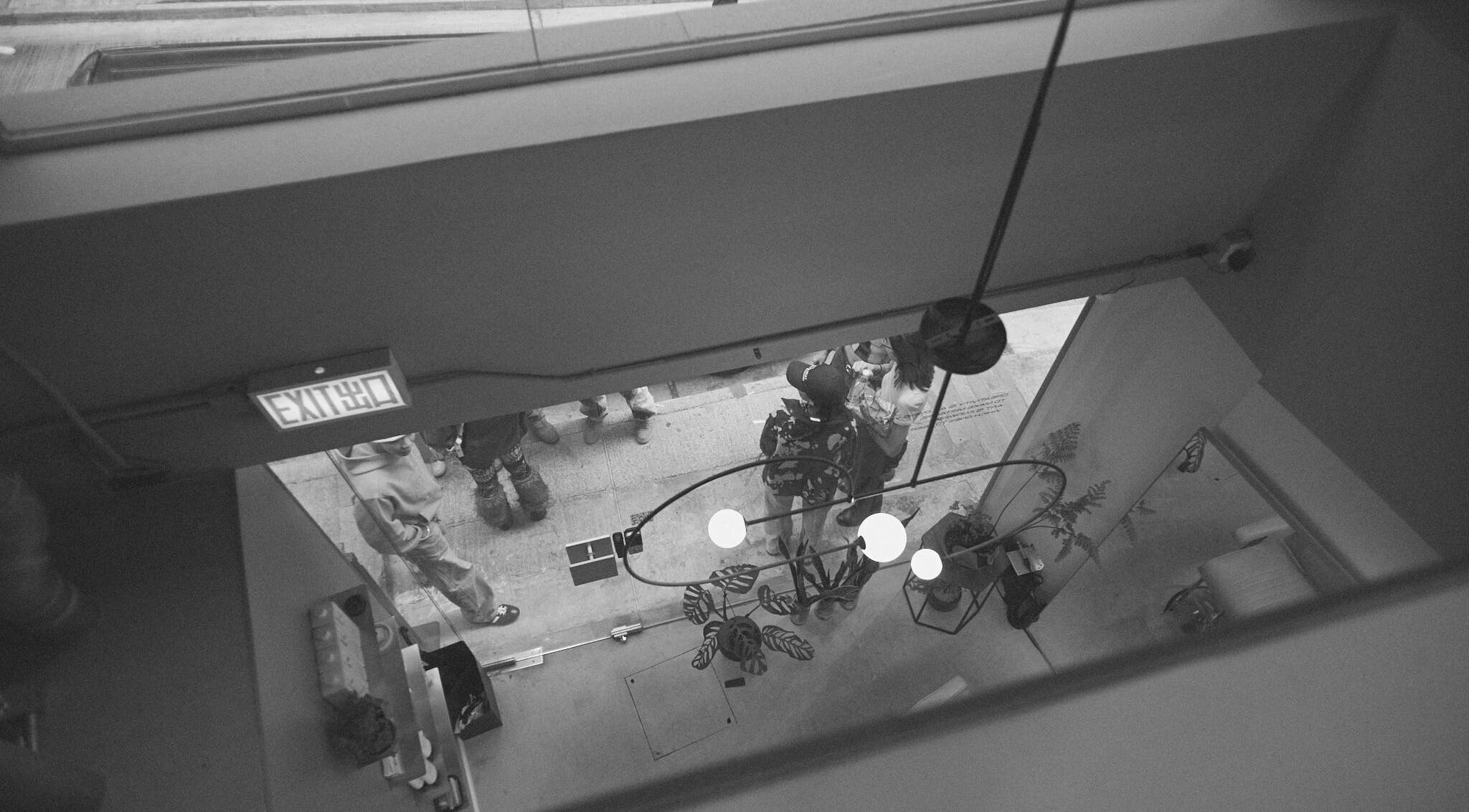 Overhead view of guests at AndSpace, Hong Kong Island, HK embracing a chic industrial vibe.