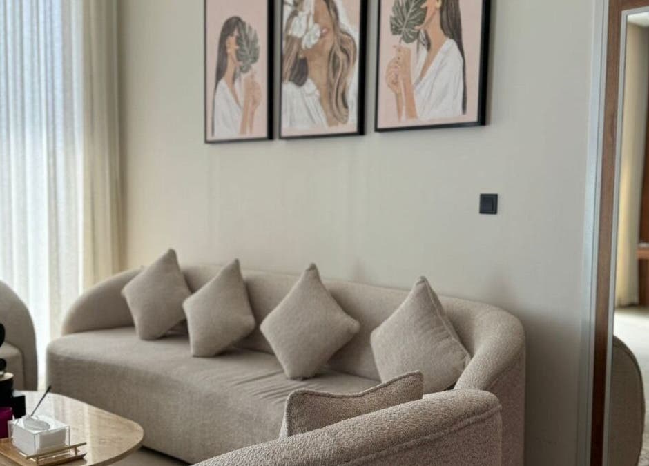 Cozy seating area with artwork at Four Sisters Salon in Shaqra, Riyadh Province, SA.