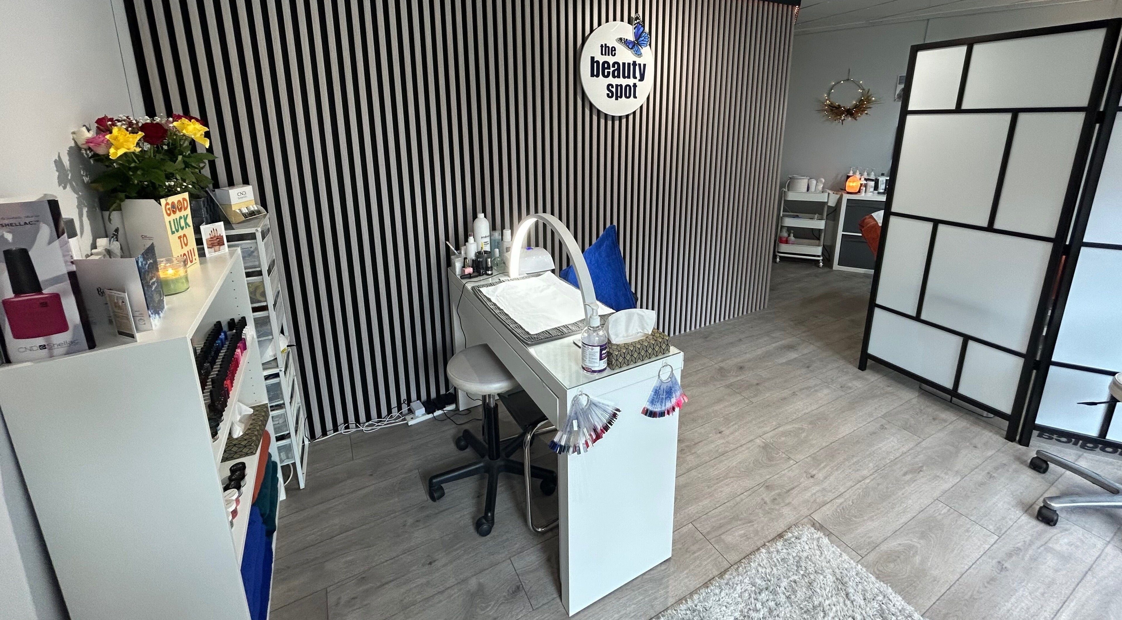 The Beauty Spot & Skincare Centre in Falkirk, Scotland, GB, showcasing a sleek nail station and modern decor.