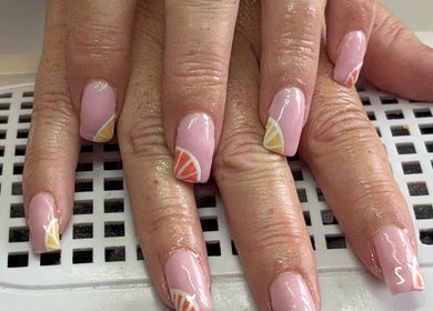 Elegant pink nails with citrus design at Beauty By Poppy Marina, Bury, England, GB.