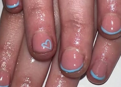 Elegant nail art with blue tips and heart at Beauty By Poppy Marina, Bury, England, GB.