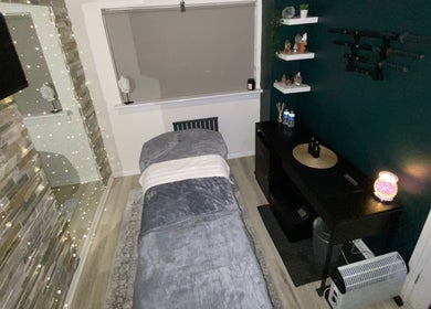 Cozy massage room at 1720 Massage Studio, Paisley, Scotland, GB, with soothing decor and ambient lighting.