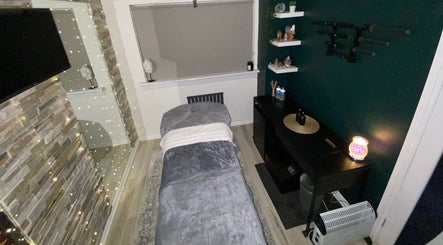 Cozy massage room at 1720 Massage Studio, Paisley, Scotland, GB, with soothing decor and ambient lighting.