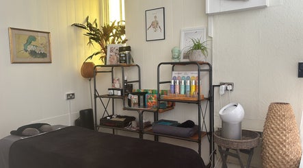 Cozy treatment room at Wellness Studio, featuring relaxing decor in South Molton, England, GB.