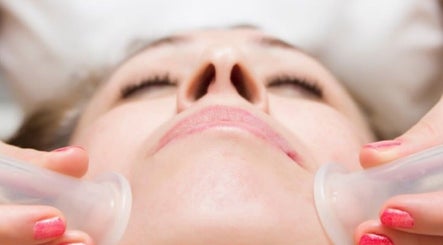 Facial cupping treatment at Wellness Studio in South Molton, England, GB enhances skin glow and relaxation.
