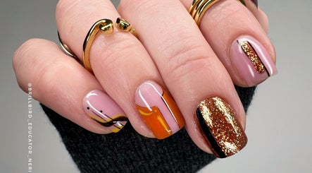 Elegant nail art featuring gold glitter and bold lines at BrillBird Nail Stylist And Educator, Cheltenham, England, GB.