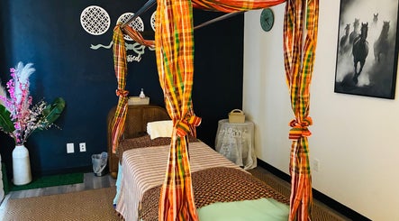 Cozy massage room at Scottsdale Thai Wellness Massage in Scottsdale, Arizona, US, with vibrant decor.