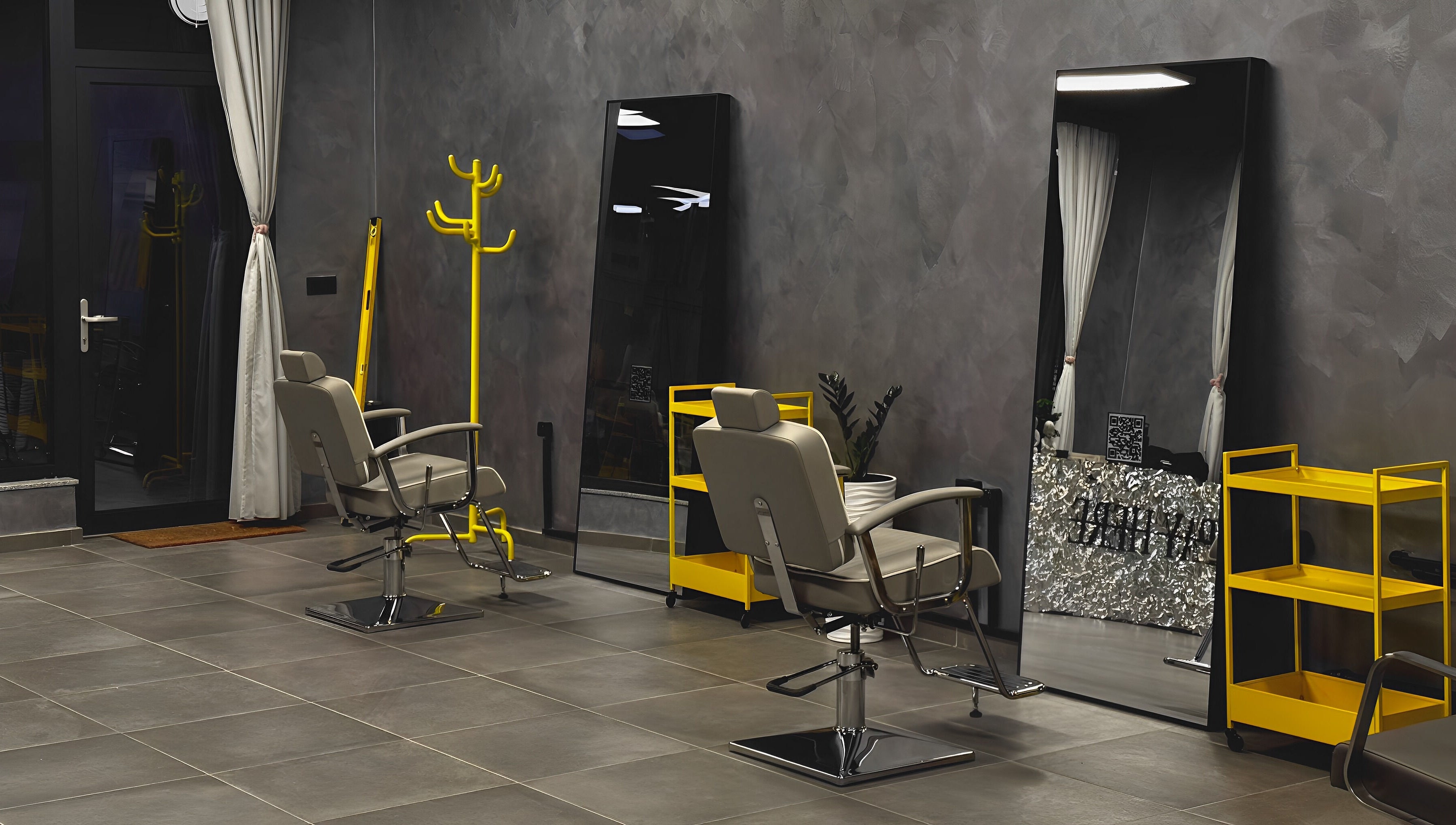 Modern salon chairs and mirrors at Studio Exit, Plovdiv, Plovdiv, BG showcasing sleek design and ambiance.