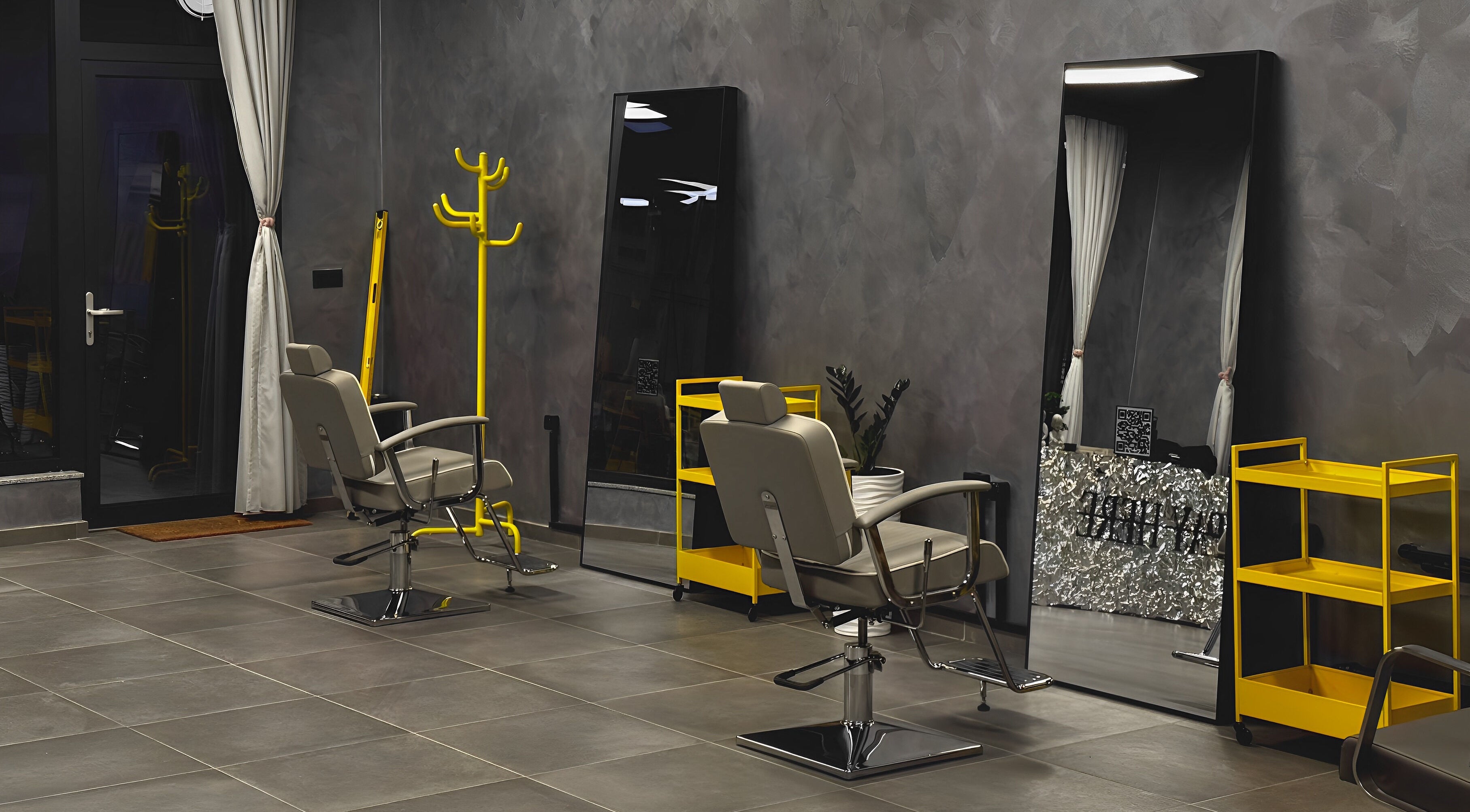 Modern salon chairs and mirrors at Studio Exit, Plovdiv, Plovdiv, BG showcasing sleek design and ambiance.