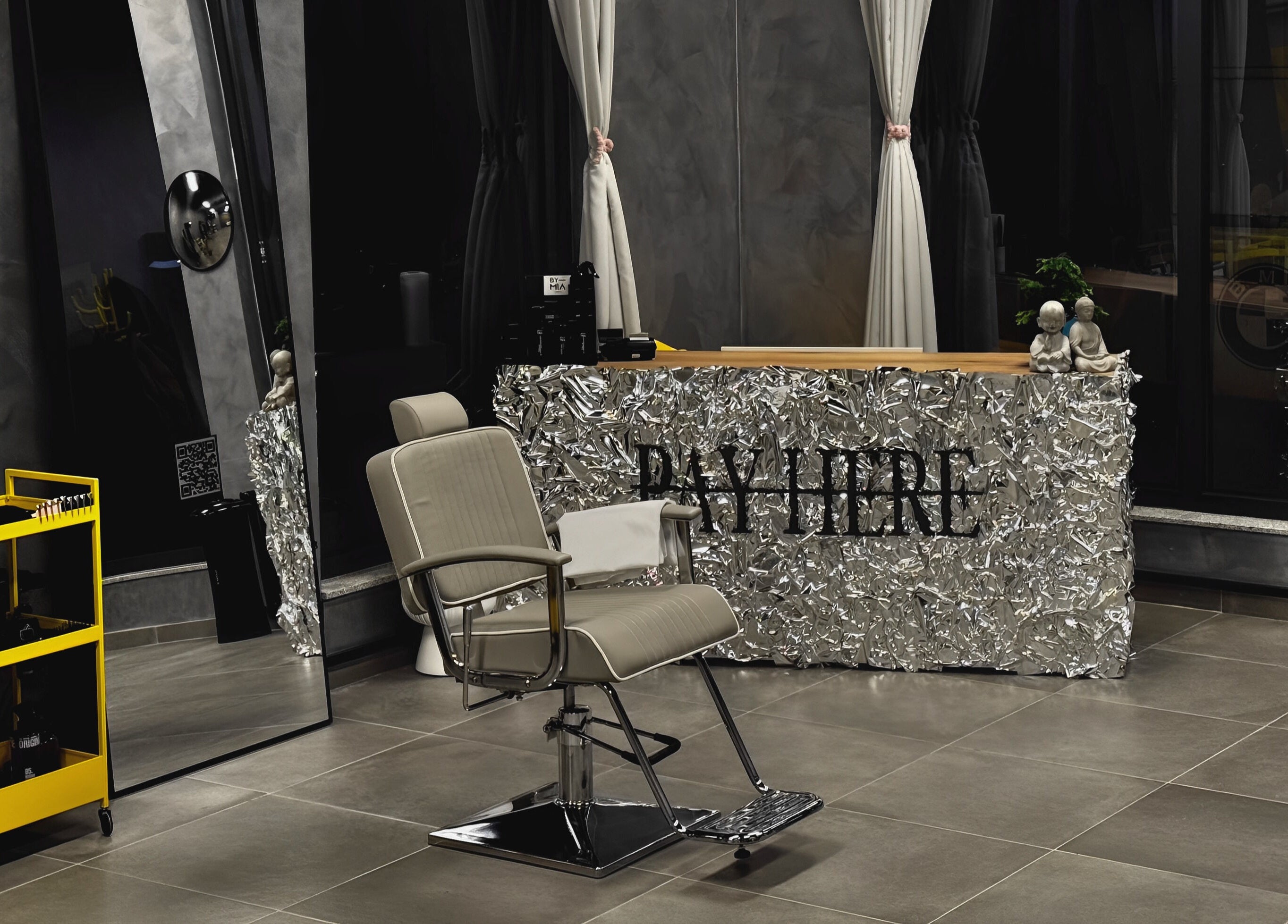 Reception area at Studio Exit, Plovdiv, showcasing modern decor and a stylish salon chair.