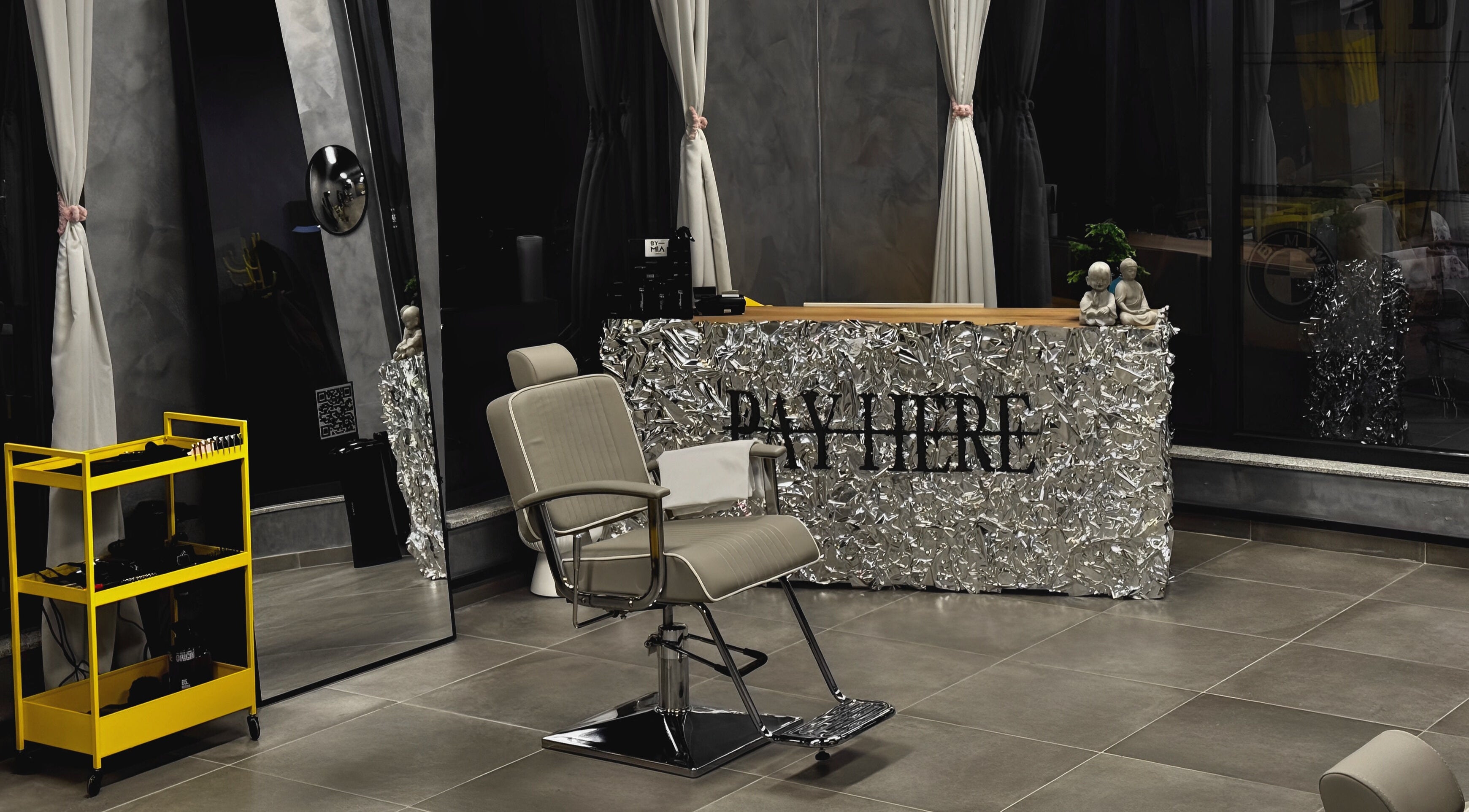 Reception area at Studio Exit, Plovdiv, showcasing modern decor and a stylish salon chair.