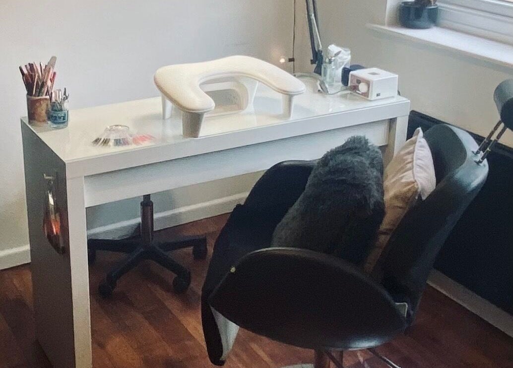 Modern nail salon setup at Nikki Halcoop Beauty, Donnington, England, GB, showcasing professional tools and comfort.