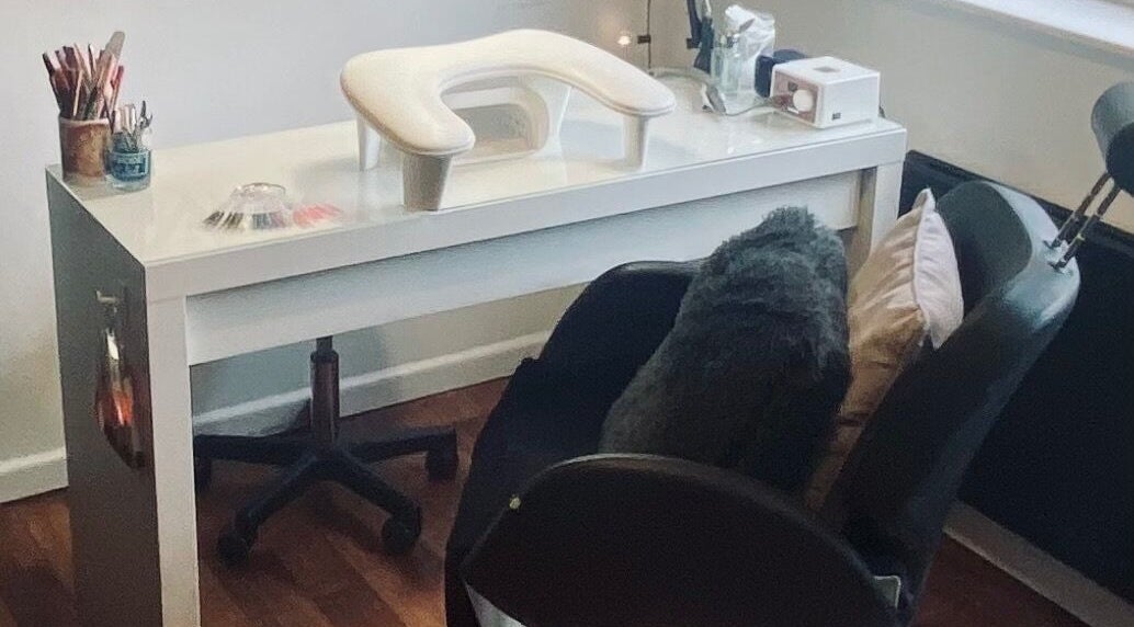 Modern nail salon setup at Nikki Halcoop Beauty, Donnington, England, GB, showcasing professional tools and comfort.