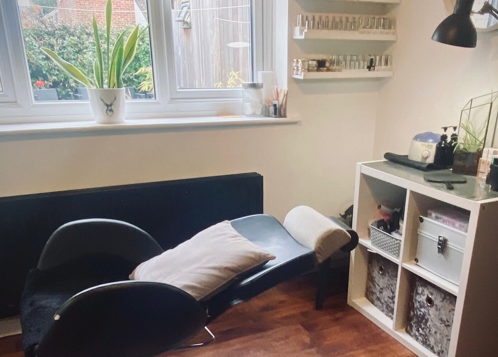 Calm beauty therapy room at Nikki Halcoop Beauty in Donnington, England, GB, featuring a chair and skincare products.