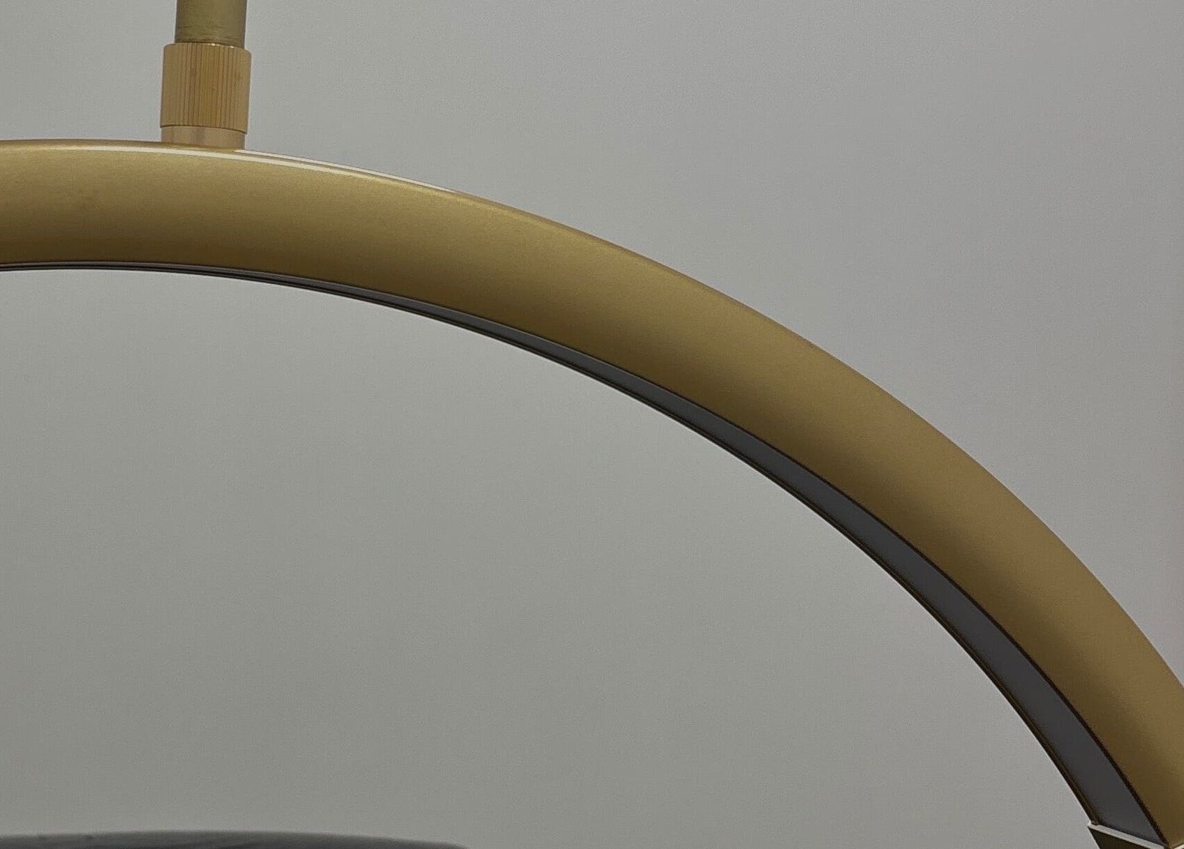 Elegant golden fixture at Obsidian Lounge, Dublin, County Dublin, IE, showcasing modern design.