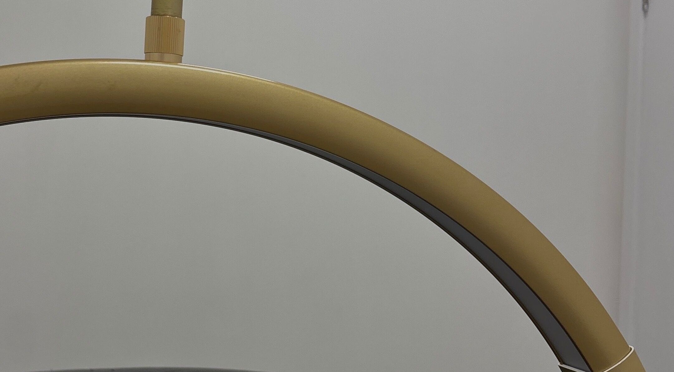 Elegant golden fixture at Obsidian Lounge, Dublin, County Dublin, IE, showcasing modern design.