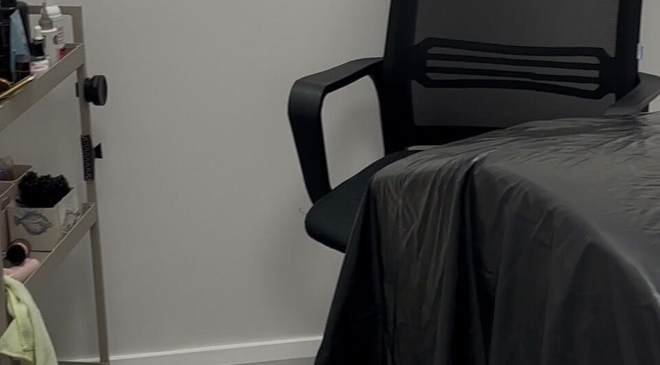 Treatment room at Obsidian Lounge, Dublin, County Dublin, IE, featuring comfortable chair and organized supplies.