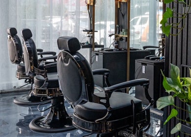 Modern salon chairs at Omen Collective in Fortitude Valley, Queensland, AU, showcase style and comfort.