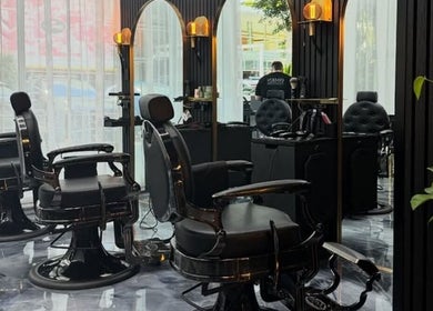 Elegant barber chairs at Omen Collective, Fortitude Valley, Queensland, AU highlighting luxury styling.