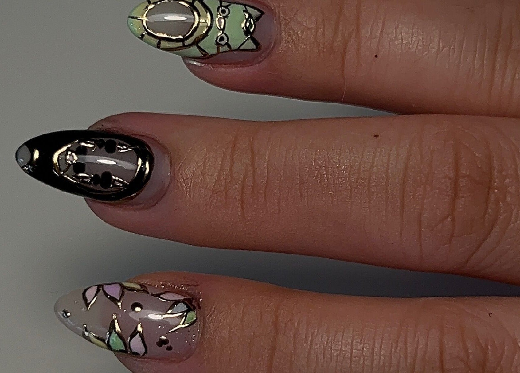 Intricate nail art design at Cured by Margaret in Guelph, Ontario, CA showcasing elegance.