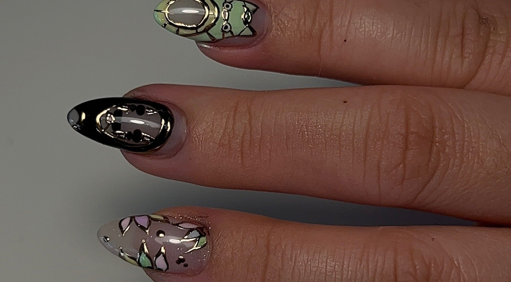 Intricate nail art design at Cured by Margaret in Guelph, Ontario, CA showcasing elegance.