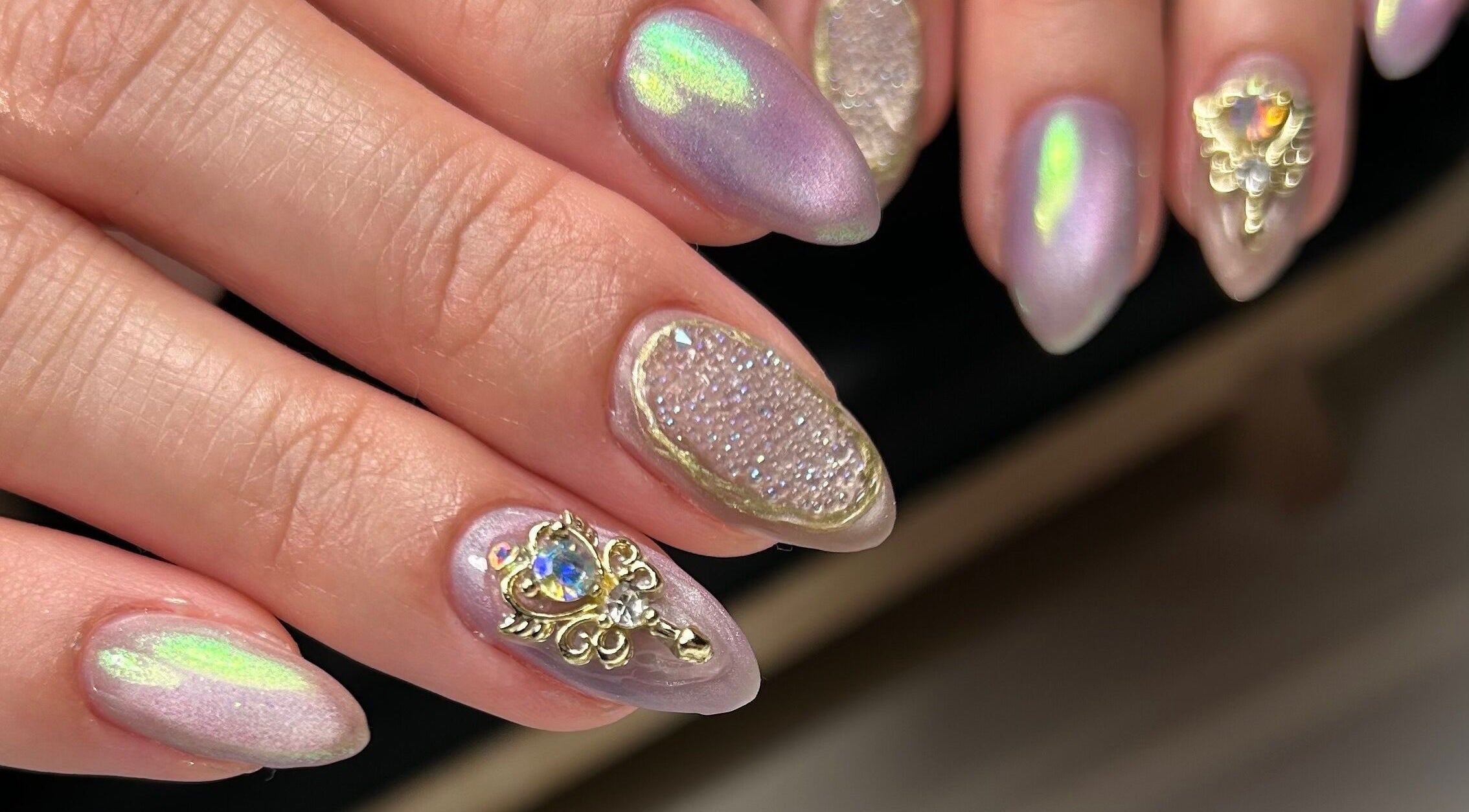 Elegant nail art with gems at Cured by Margaret, Guelph, Ontario, CA.