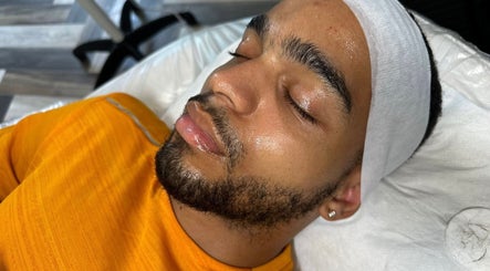 Client enjoying a facial treatment at Muniira's Clinic, London, England, GB for rejuvenated skin.