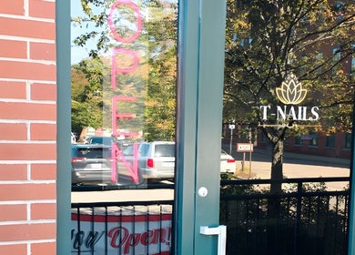 Entrance of T-Nails Glam Studio with open sign in Providence, Rhode Island, US.