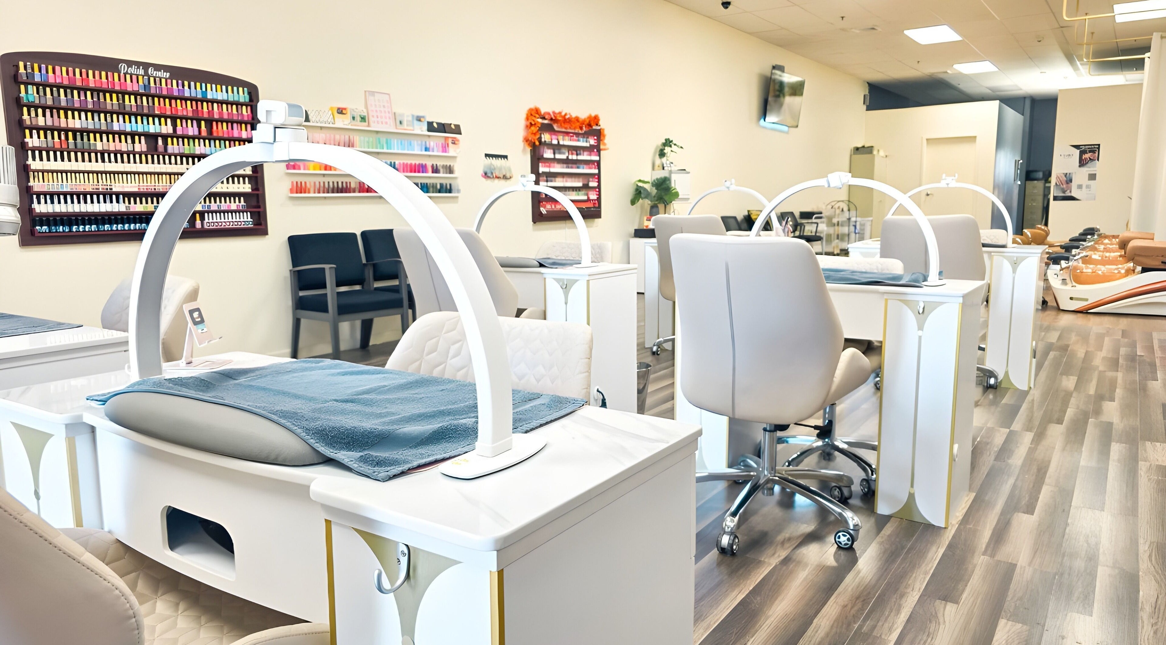 Modern nail salon interior of T-Nails Glam Studio in Providence, Rhode Island, US with sleek workstations.