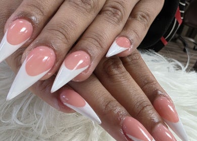 Stunning stiletto nails with pink and white design at T-Nails Glam Studio, Providence, Rhode Island, US.
