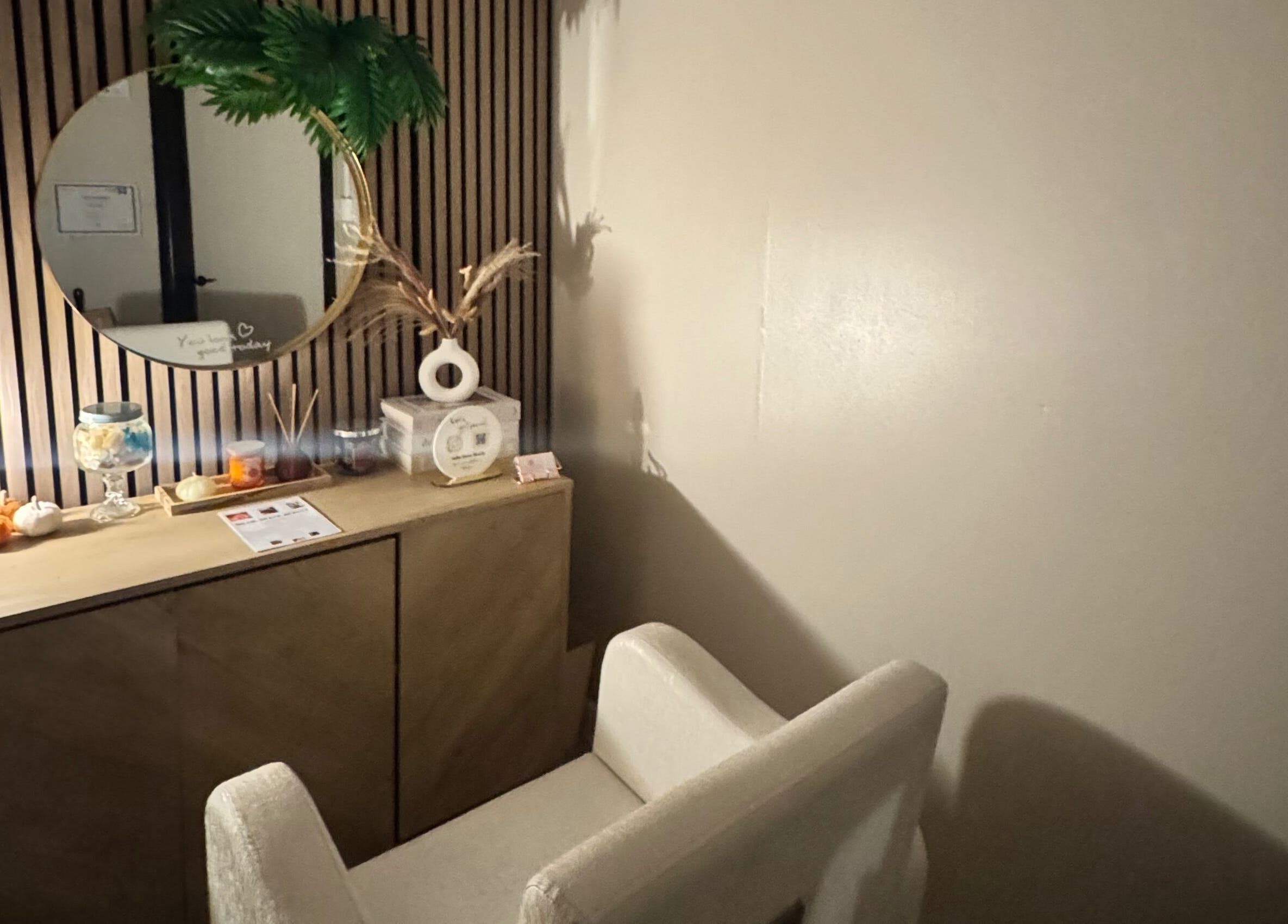 Relaxing corner at Millie Grace Beauty in Barry, Wales with chair, mirror, and decor.