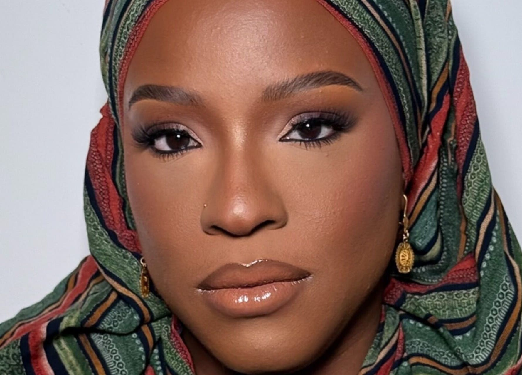 Elegant makeup look at INTISAR in London, England, GB featuring bold eyes and glossy lips.