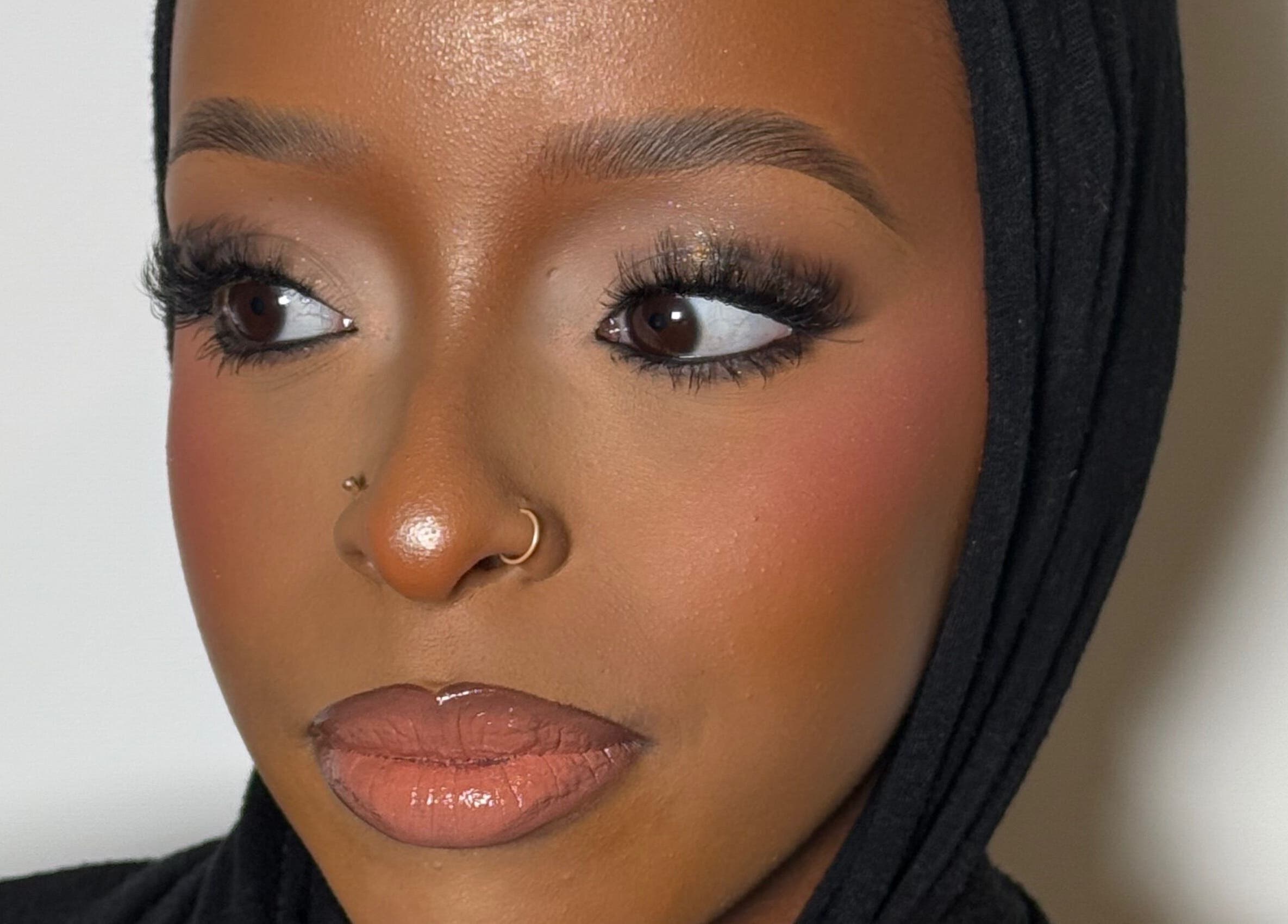 Close-up of a woman's face with elegant makeup at INTISAR, London, England, GB.