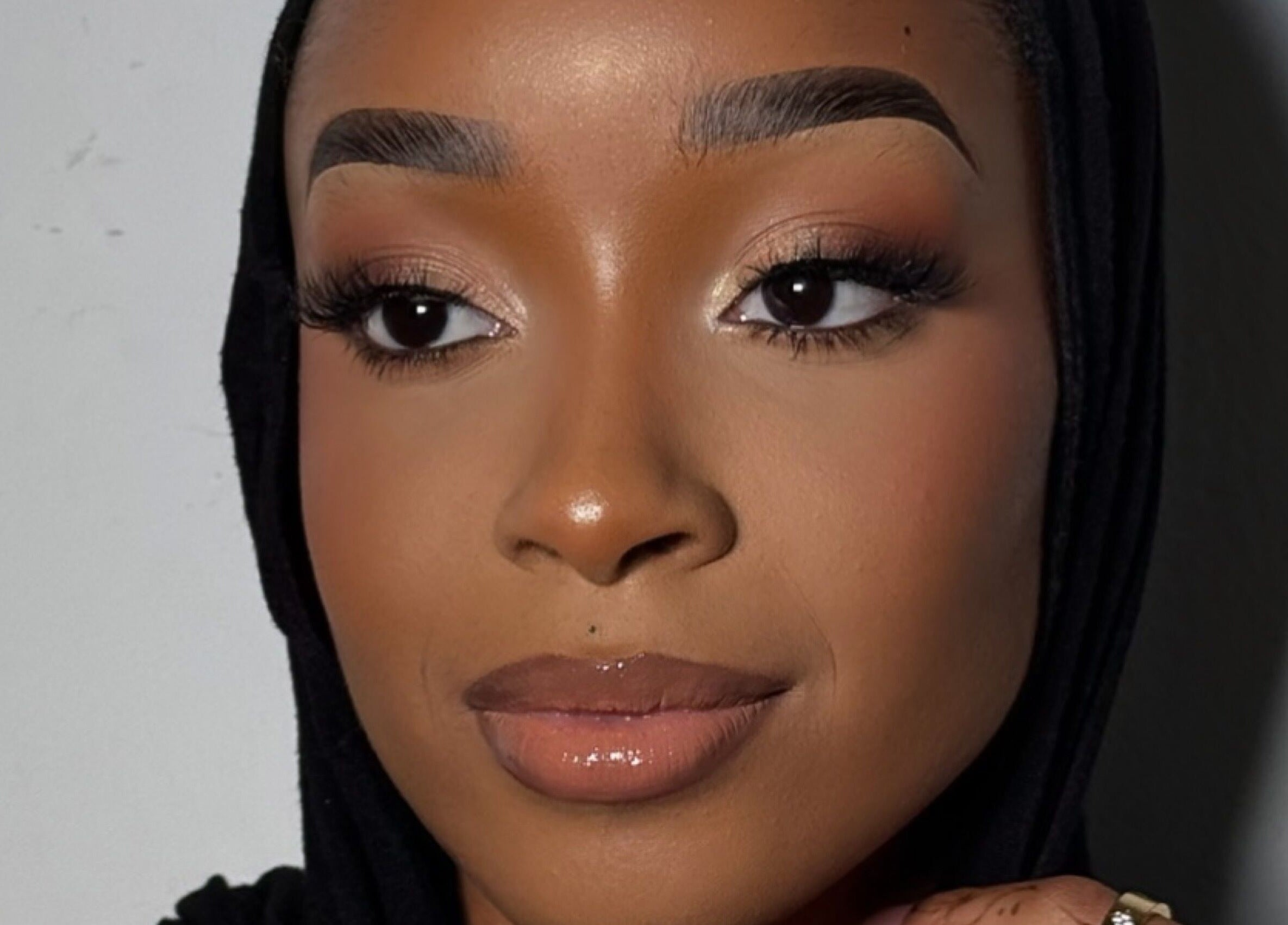 Close-up portrait showing a flawless makeup look at INTISAR in London, England, GB.
