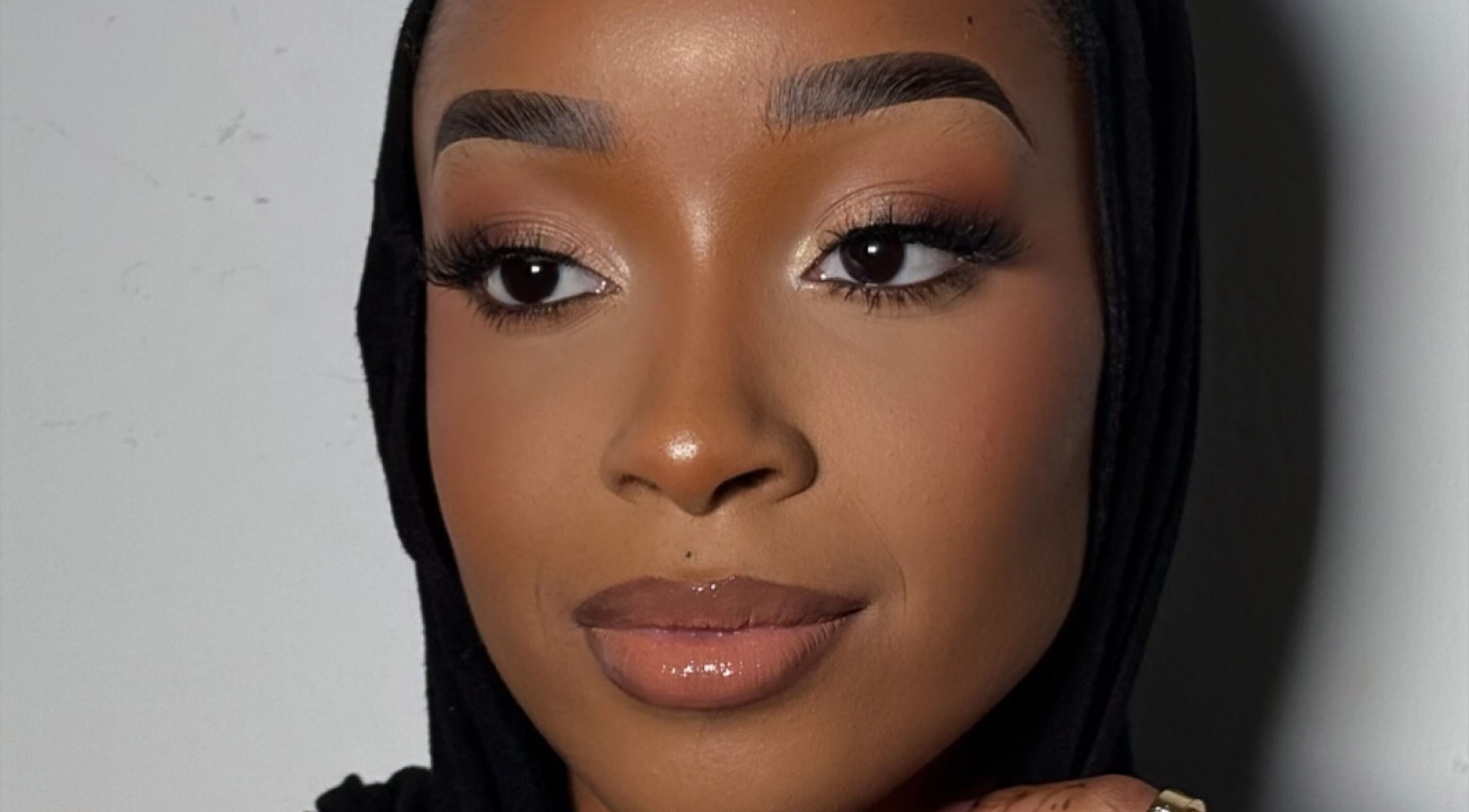 Close-up portrait showing a flawless makeup look at INTISAR in London, England, GB.