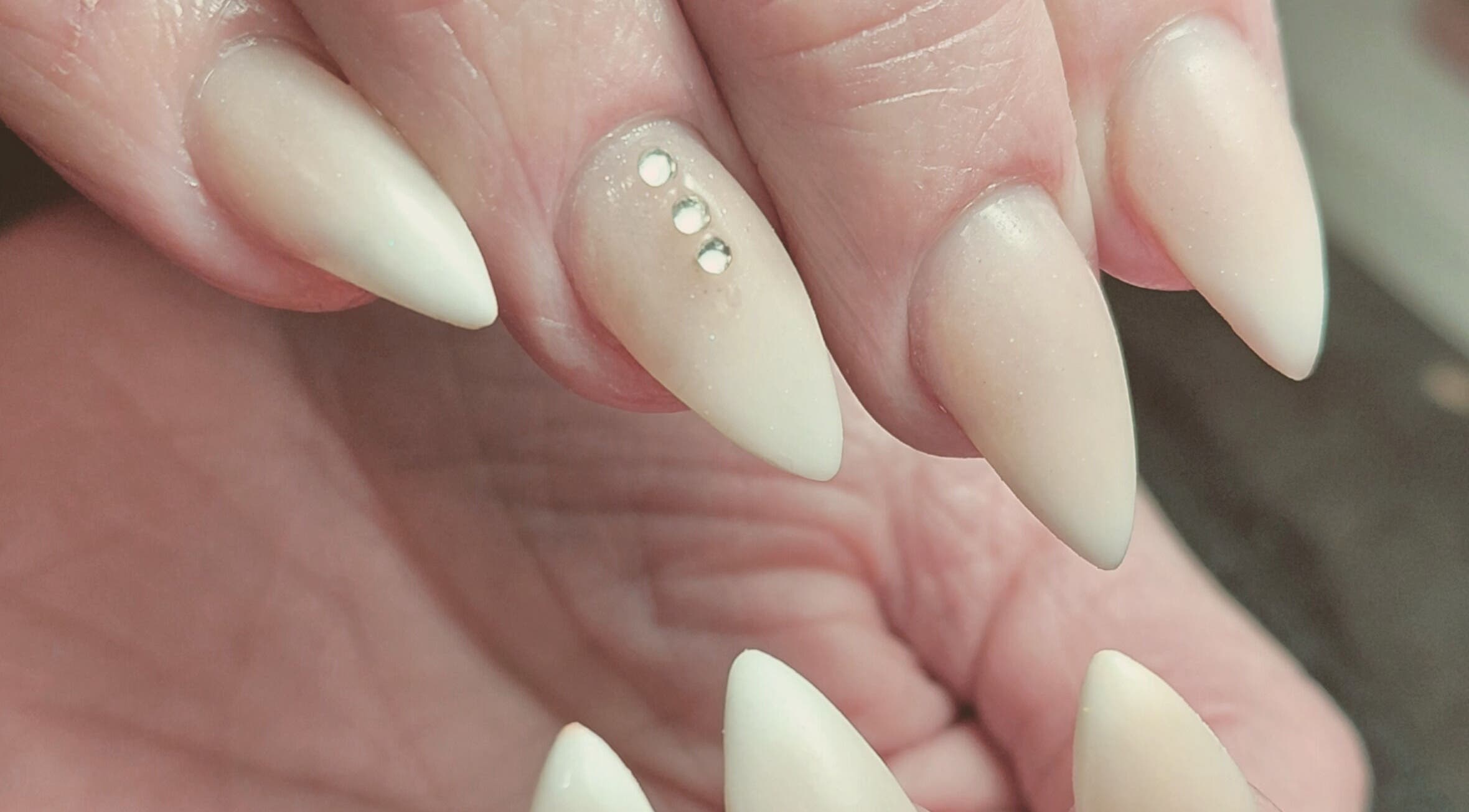 Elegant manicured nails with rhinestones at Damour Nails and Beauty, Kempton Park, Gauteng, ZA.