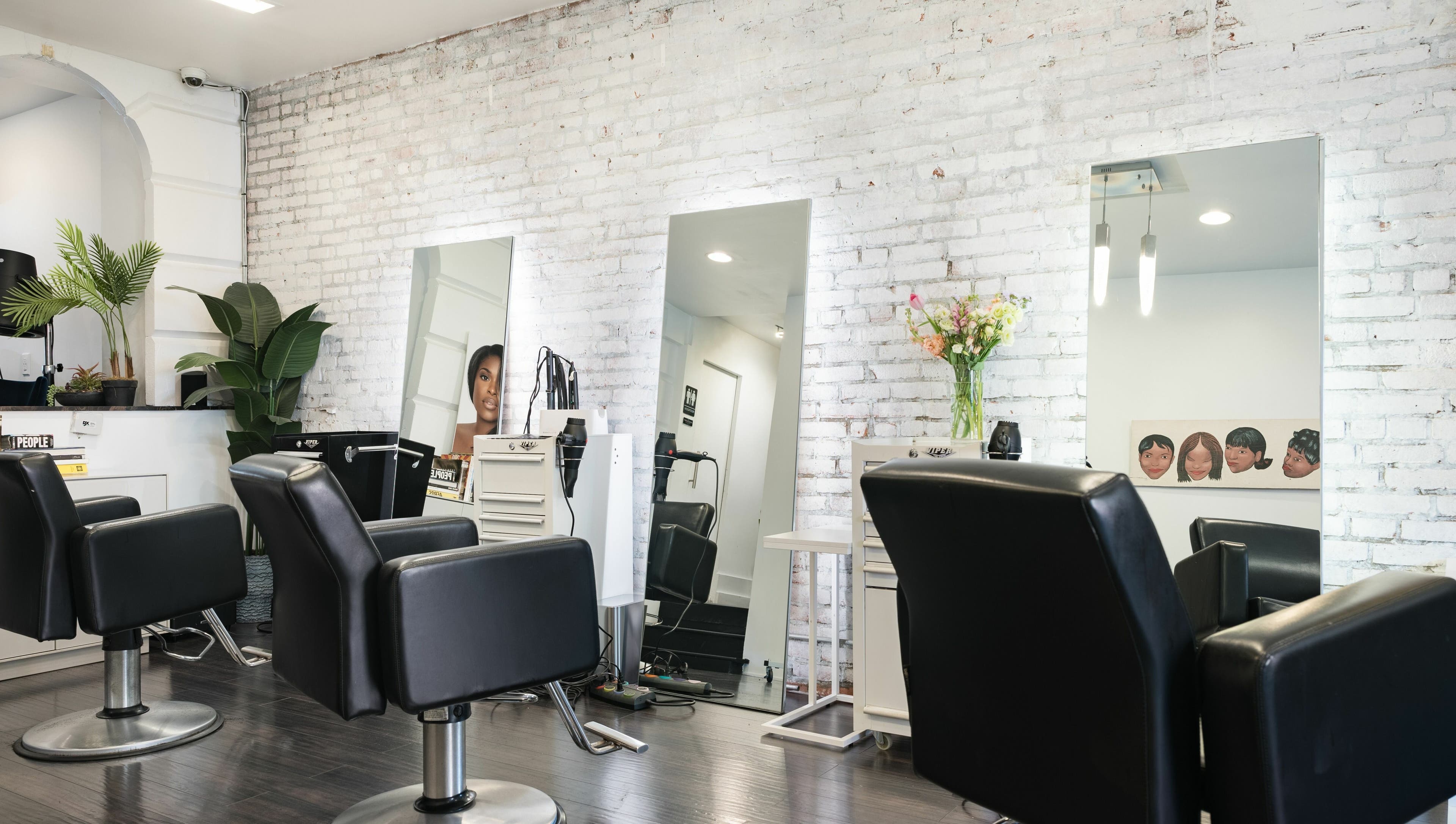 Modern chairs and mirrors at H2 Salon Brooklyn in New York, New York, US, showcasing stylish decor.