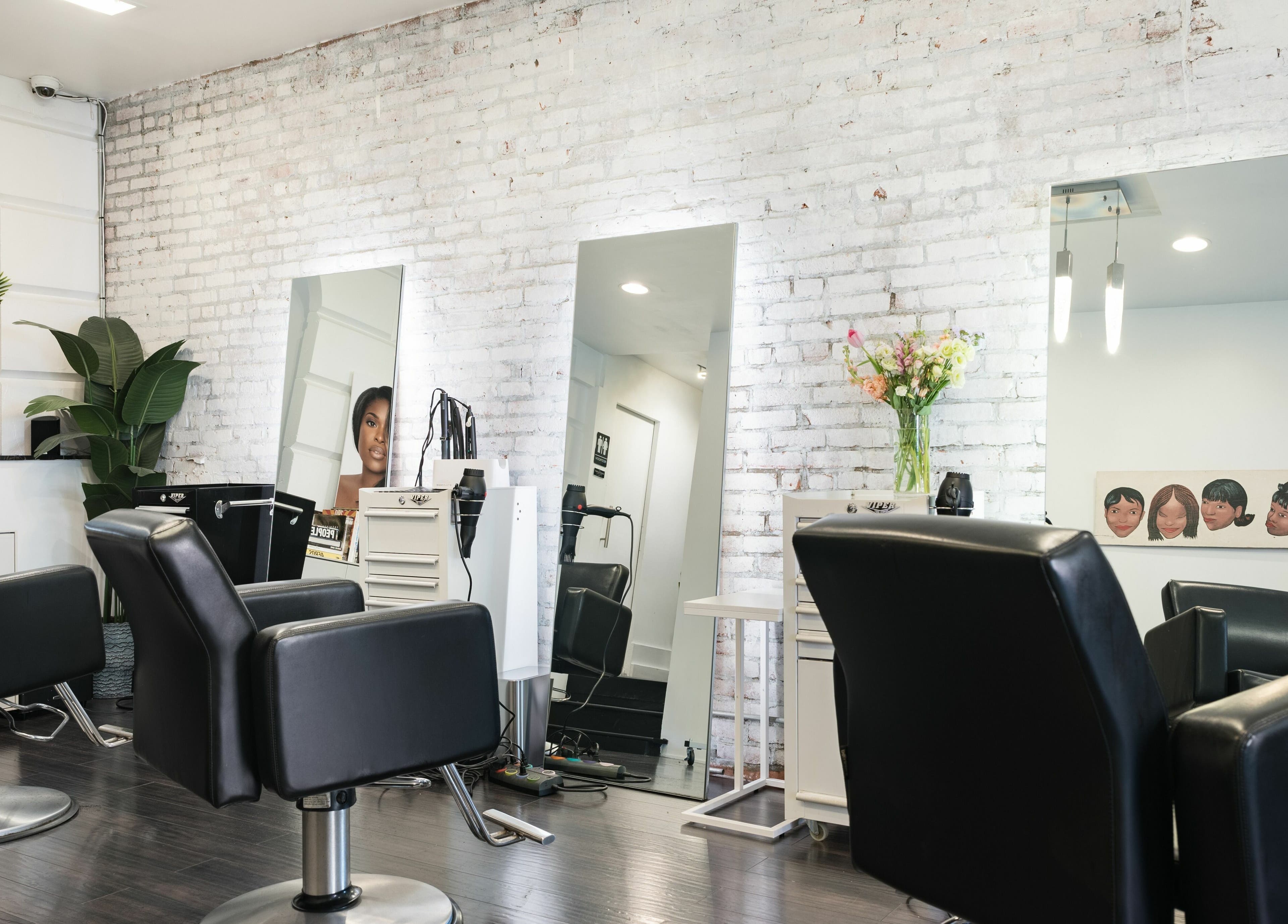 Modern chairs and mirrors at H2 Salon Brooklyn in New York, New York, US, showcasing stylish decor.