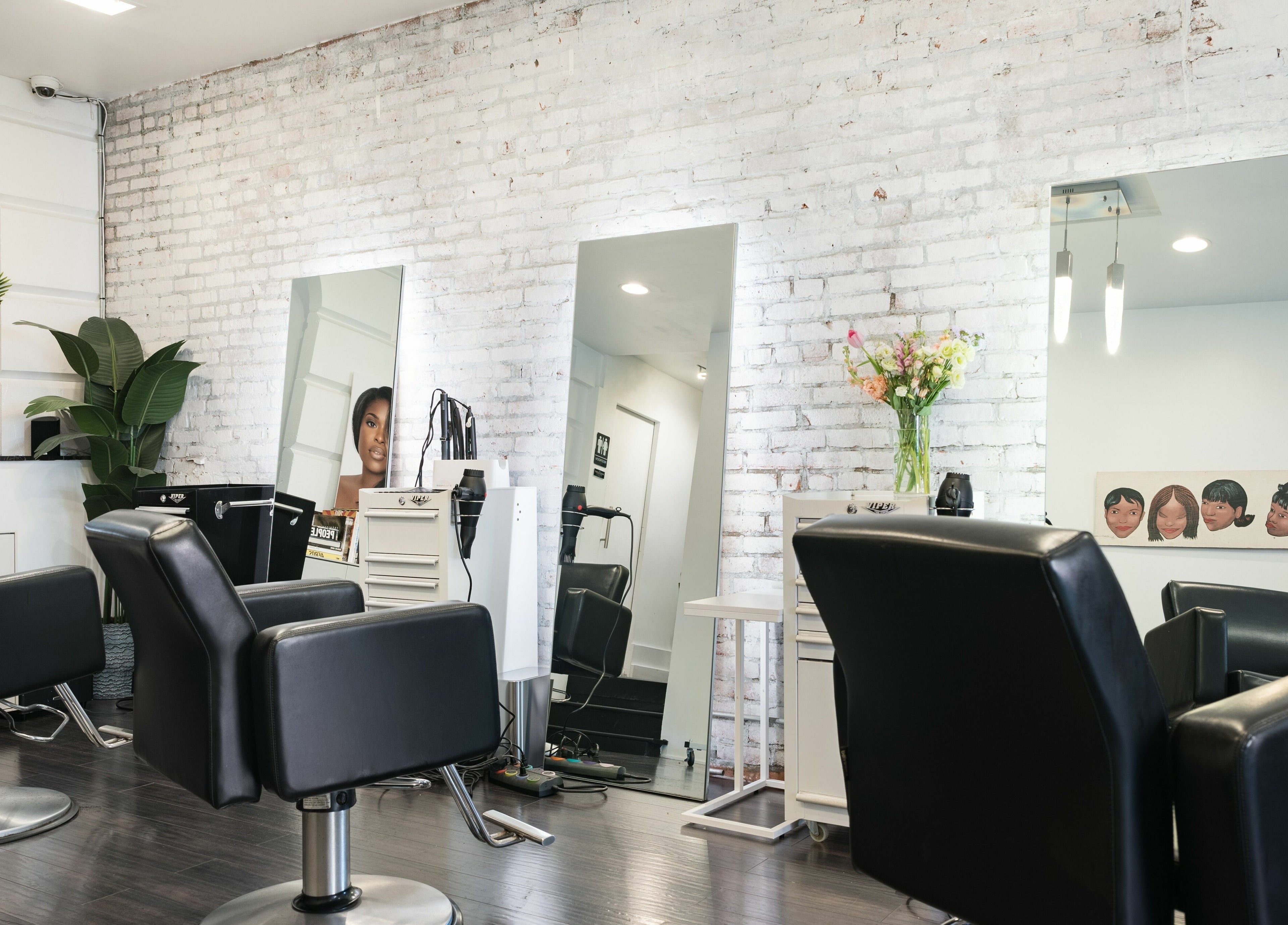 Modern chairs and mirrors at H2 Salon Brooklyn in New York, New York, US, showcasing stylish decor.