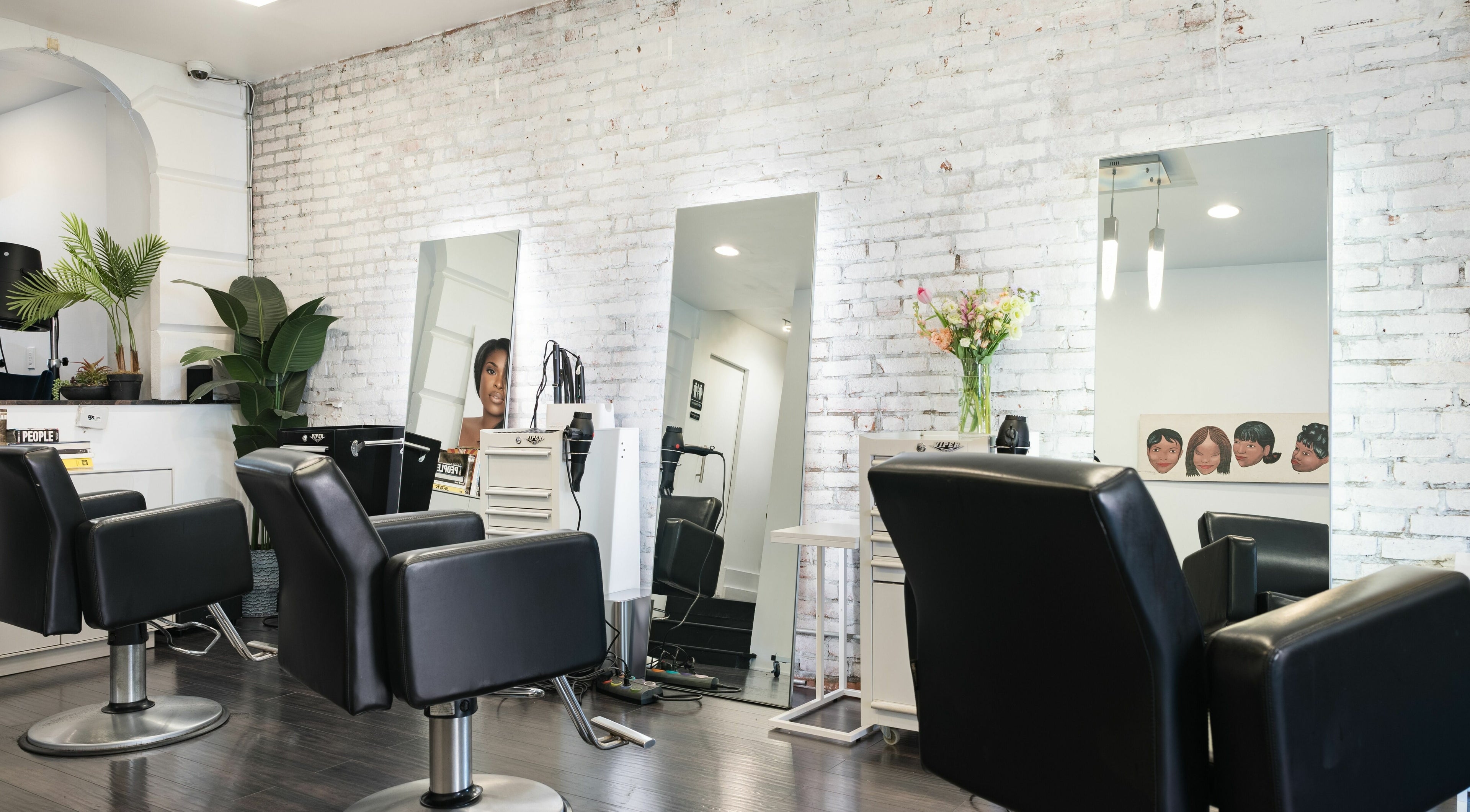 Modern chairs and mirrors at H2 Salon Brooklyn in New York, New York, US, showcasing stylish decor.
