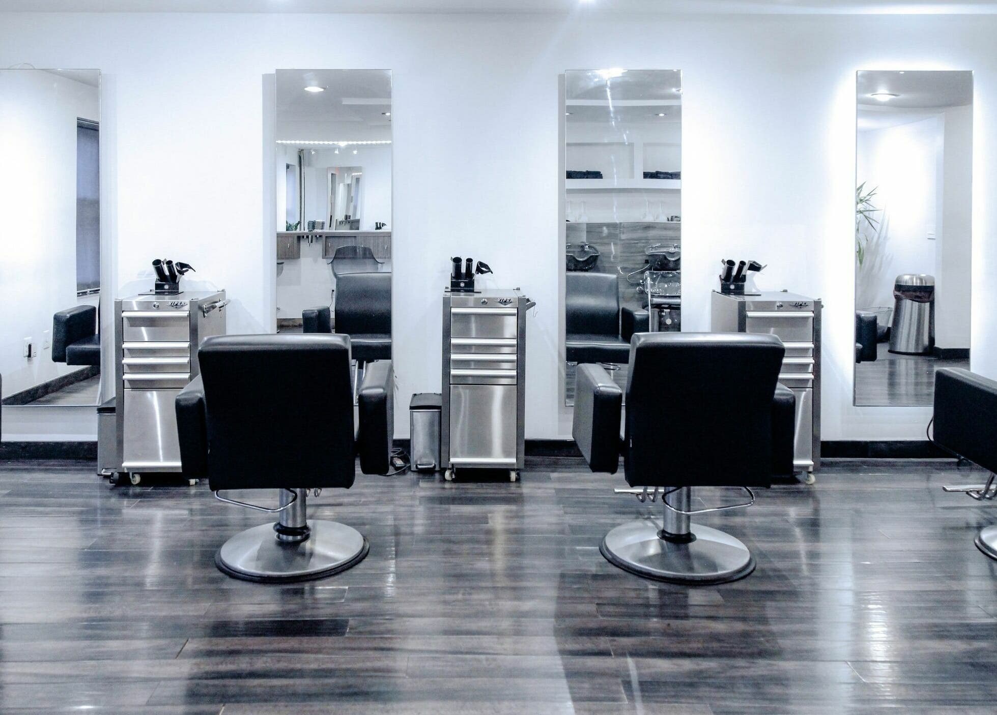 Modern salon chairs and mirrors at H2 Salon Brooklyn, New York, New York, US offering stylish beauty services.
